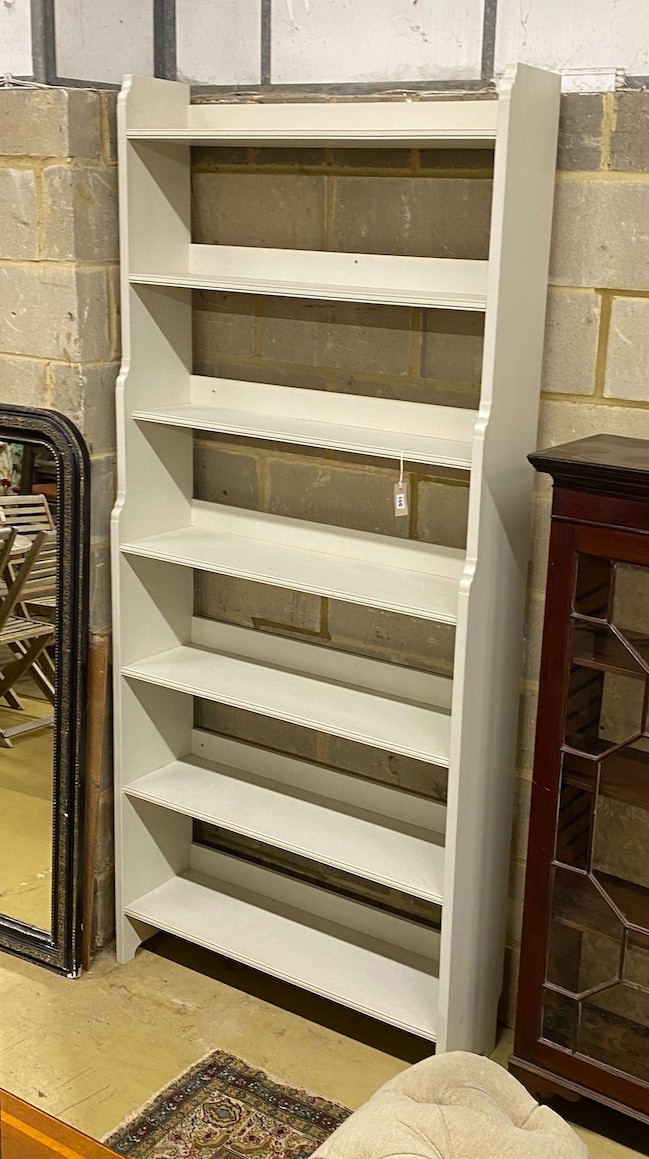 A modern painted open bookcase, width 100cm, depth 28cm, height 224cm